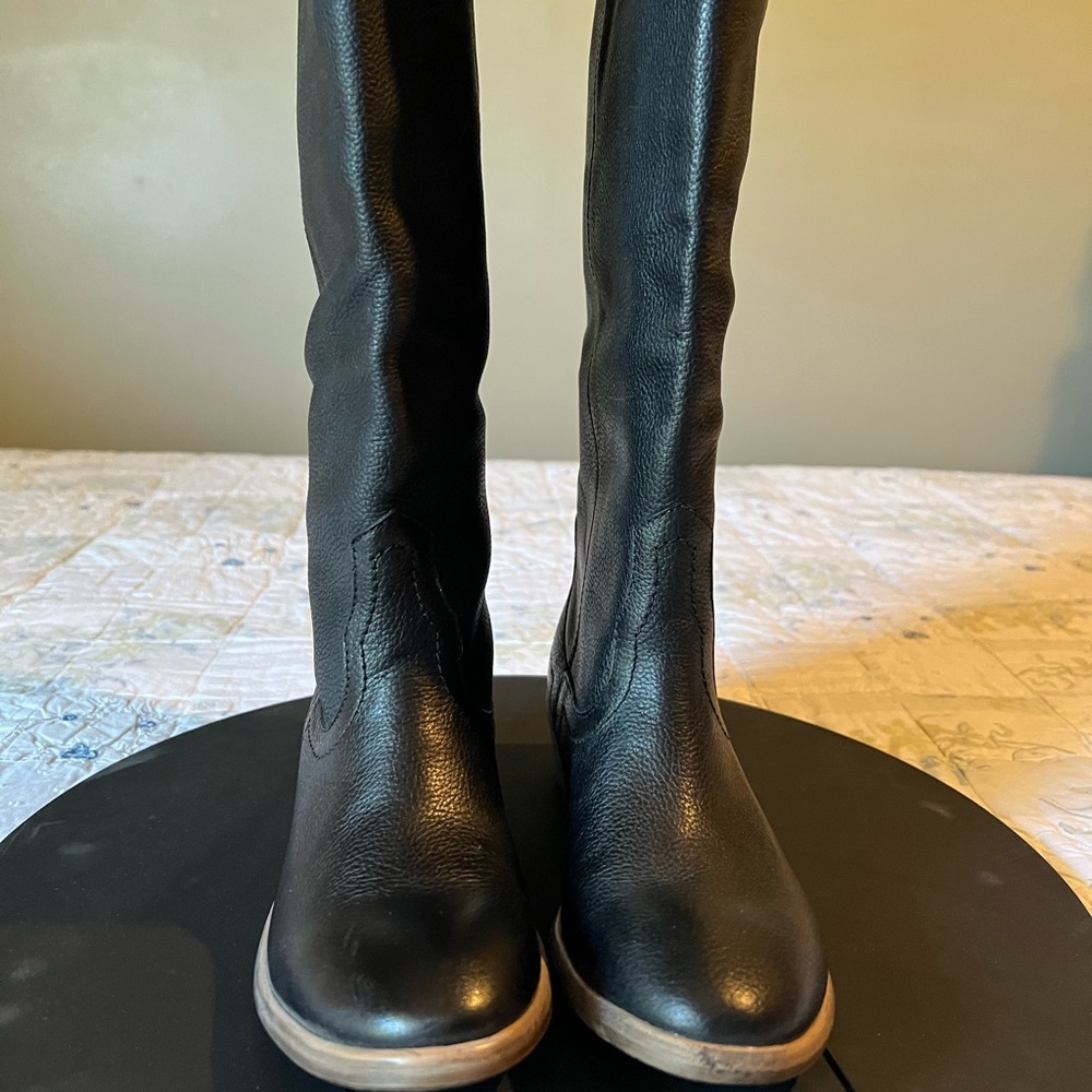 Knee high black leather boots